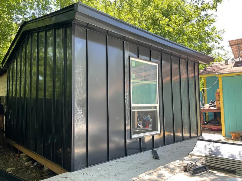 Black standing seam metal wall panels for Roof Inspection in Pace